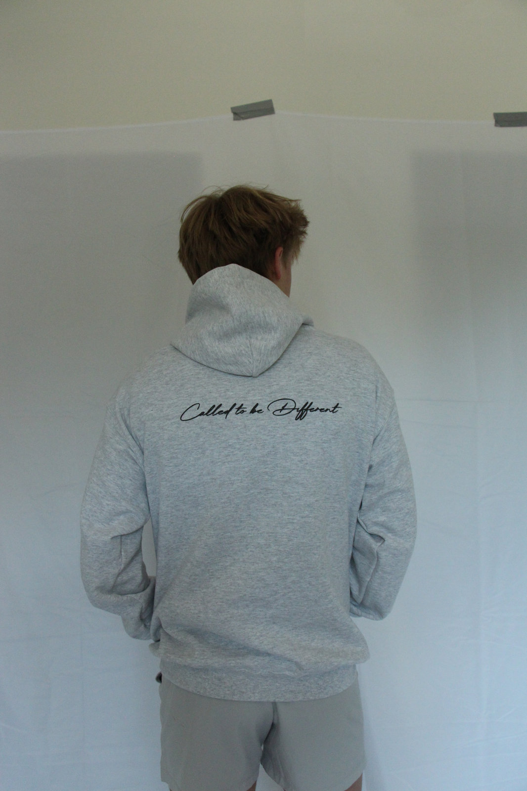 Grey Tr1n1ty hoodie with hand-pressed script lettering
